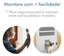 Child and dog near doors monitored by small security cameras for home safety.