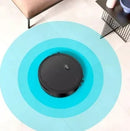 Smart robot vacuum cleaner on tile floor with cleaning sensors in a modern living room