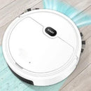 White robotic vacuum cleaner cleaning a light wood floor with water and light effects
