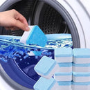 Hand placing blue and white washing machine cleaning tablet into washer drum with water
