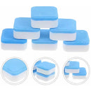 Blue and white cleaning tablets for household use, stacked and shown close-up