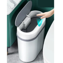 Sensor touchless trash can in modern bathroom, hand activating automatic lid