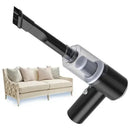 Portable handheld vacuum cleaner with brush nozzle shown near a beige sofa, home cleaning tool